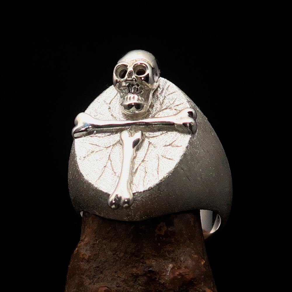 Men's sterling silver ring featuring a Bone Cross and R.I.P Skull design with a matte finish and polished accents.