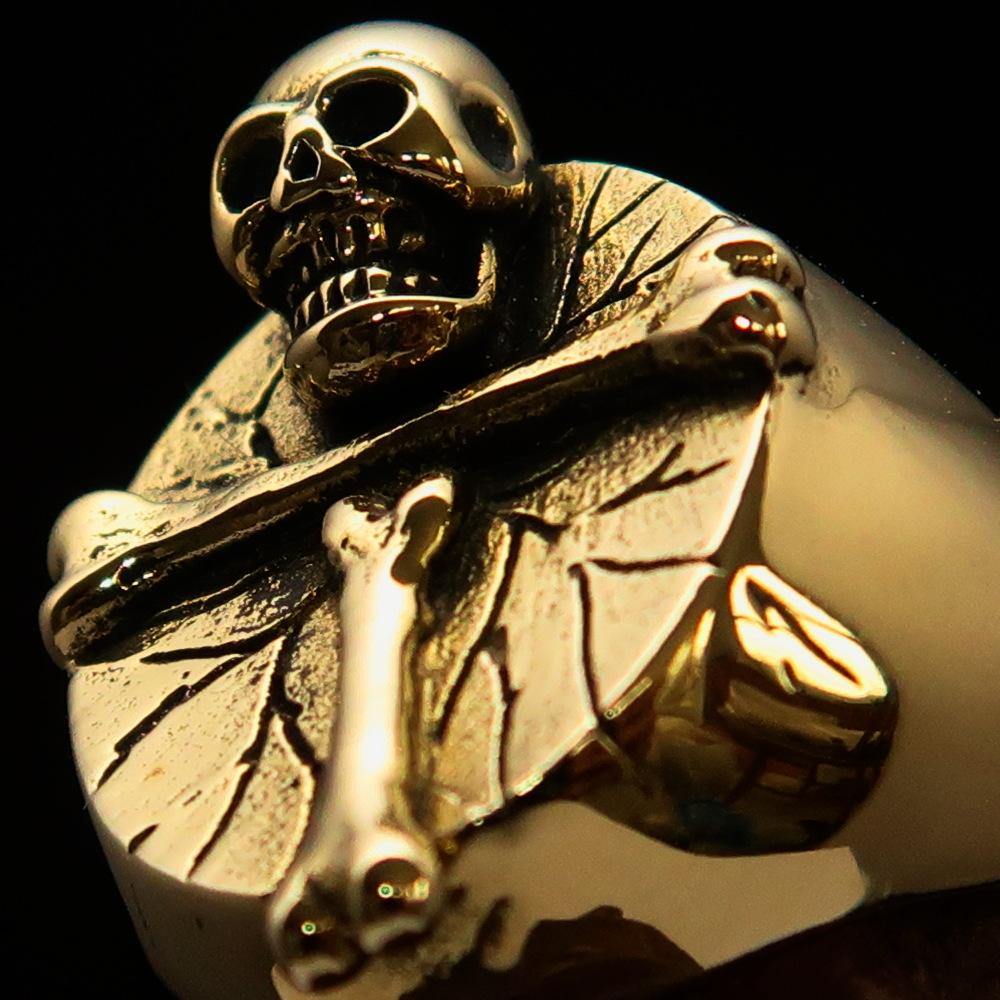 Men's Skull Ring made of solid brass featuring an R.I.P design, showcasing intricate details and a polished finish.