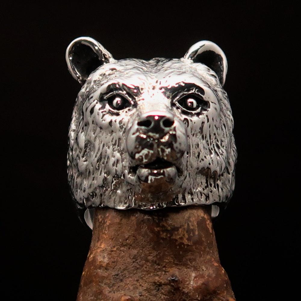 Men's sterling silver ring featuring an antiqued grizzly bear design, showcasing quality craftsmanship and unique style.