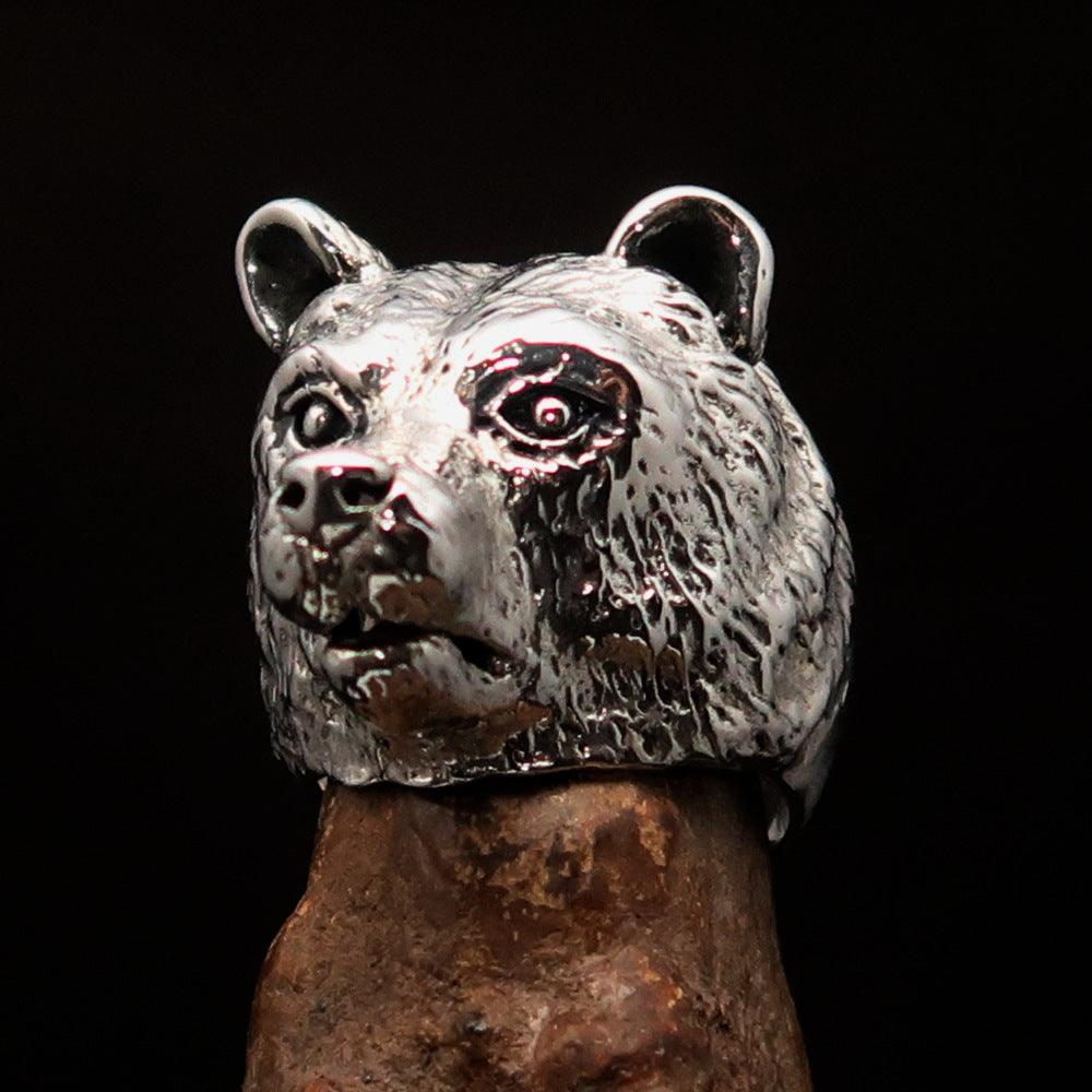 Men's sterling silver ring featuring an antiqued grizzly bear design, showcasing quality craftsmanship and unique style.