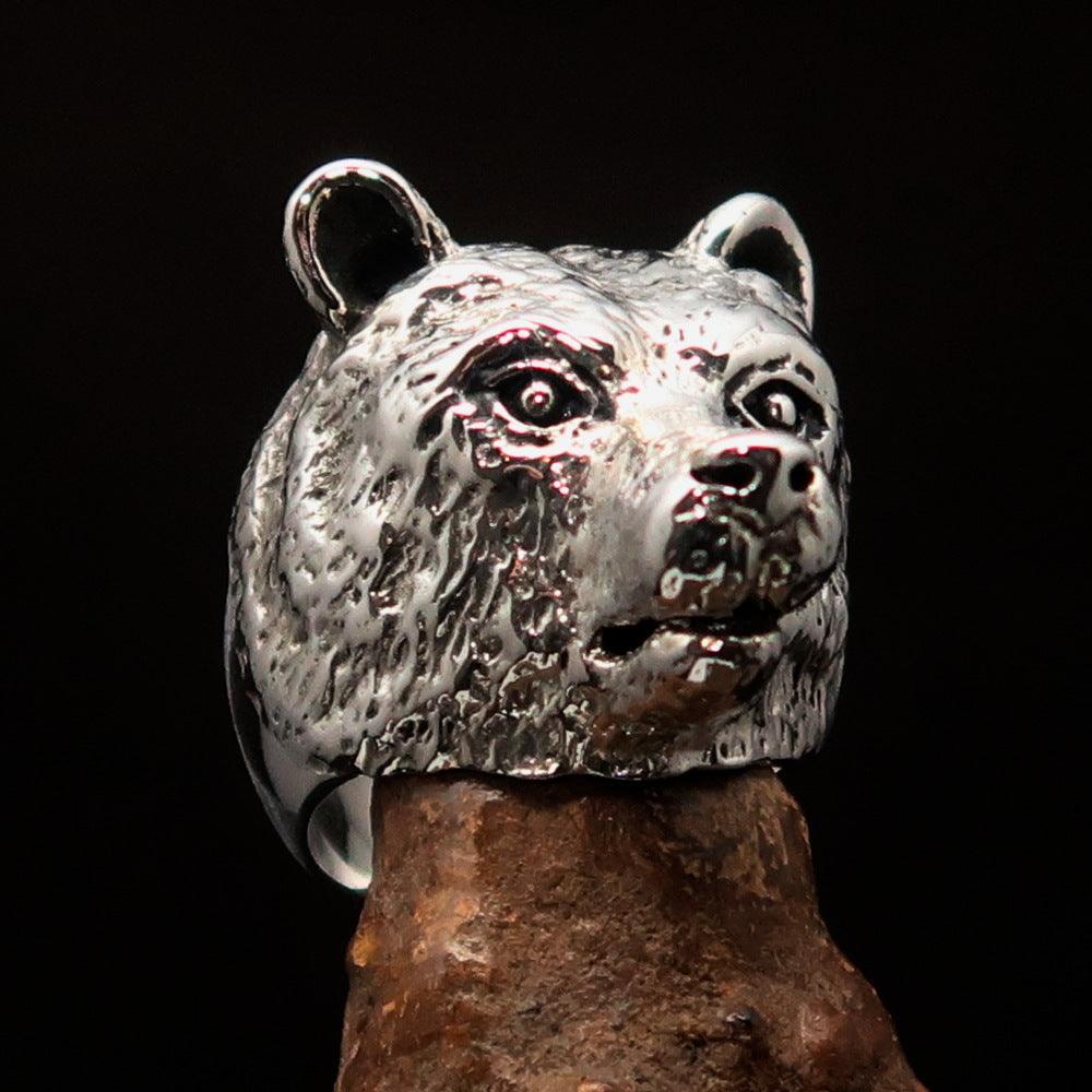 Men's sterling silver ring featuring an antiqued grizzly bear design, showcasing quality craftsmanship and unique style.