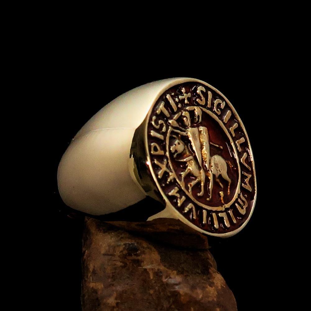 Men's Templar Knight Seal Ring made of solid brass with a high-polished finish and vibrant orange enamel, showcasing intricate design.