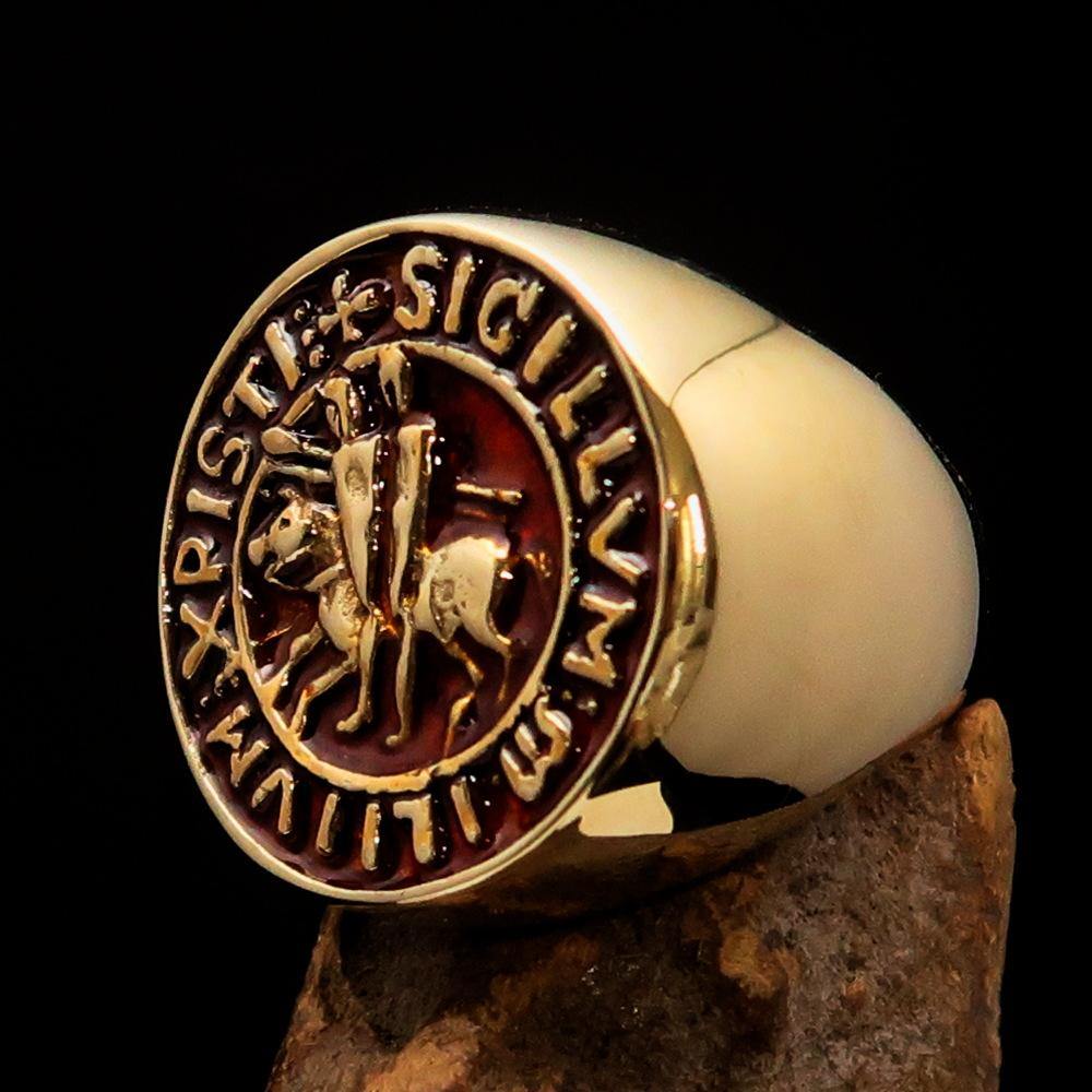 Men's Templar Knight Seal Ring made of solid brass with a high-polished finish and vibrant orange enamel, showcasing intricate design.