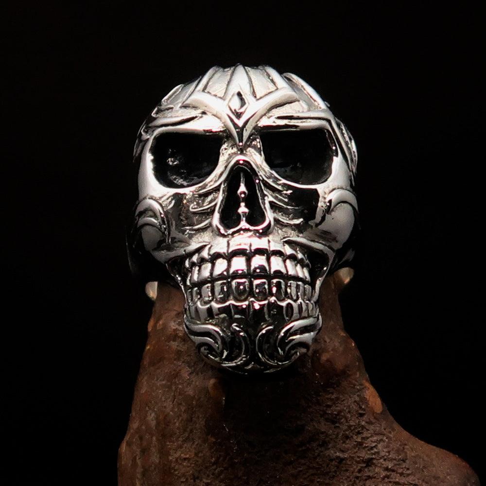 Men's Tribal Skull Ring made of solid sterling silver with a high polished and antiqued finish, featuring intricate tribal designs.