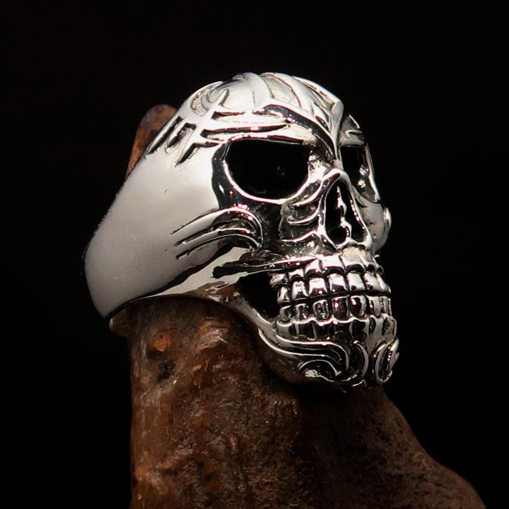 Men's Tribal Skull Ring made of solid sterling silver with a high polished and antiqued finish, featuring intricate tribal designs.