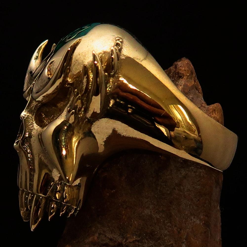 Men's Vampire Skull Ring featuring a green diamond accent, crafted from solid brass with a high polished finish and green enamel.