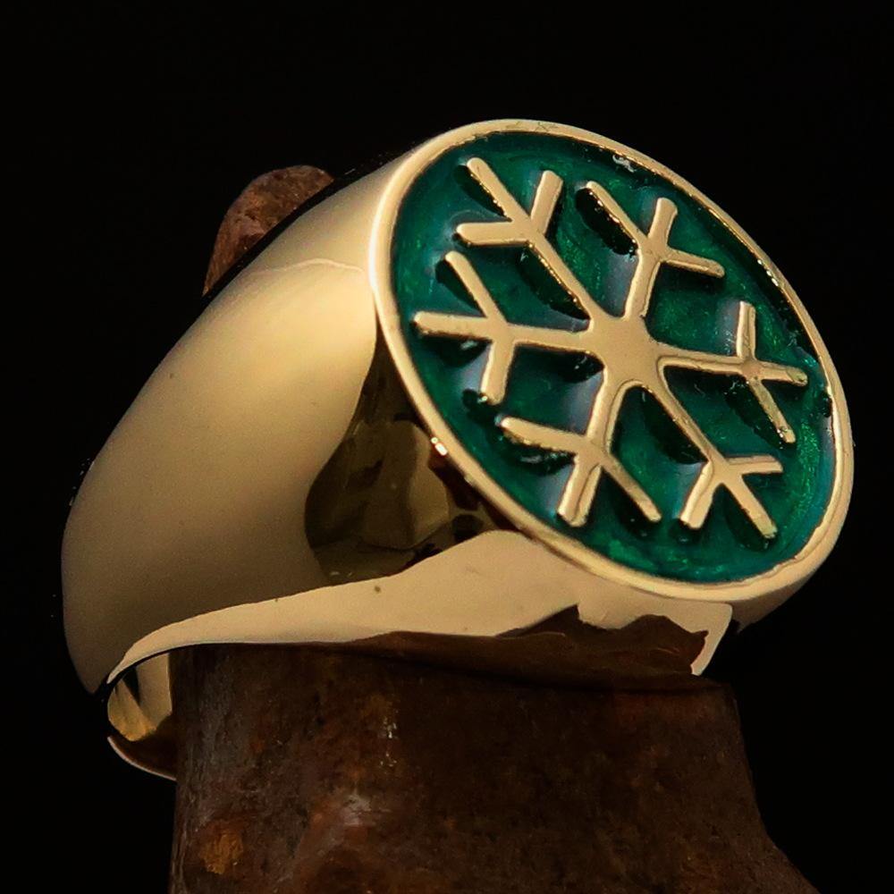 Men's Winter Ring made of solid brass featuring a green snowflake design, polished to a high shine.