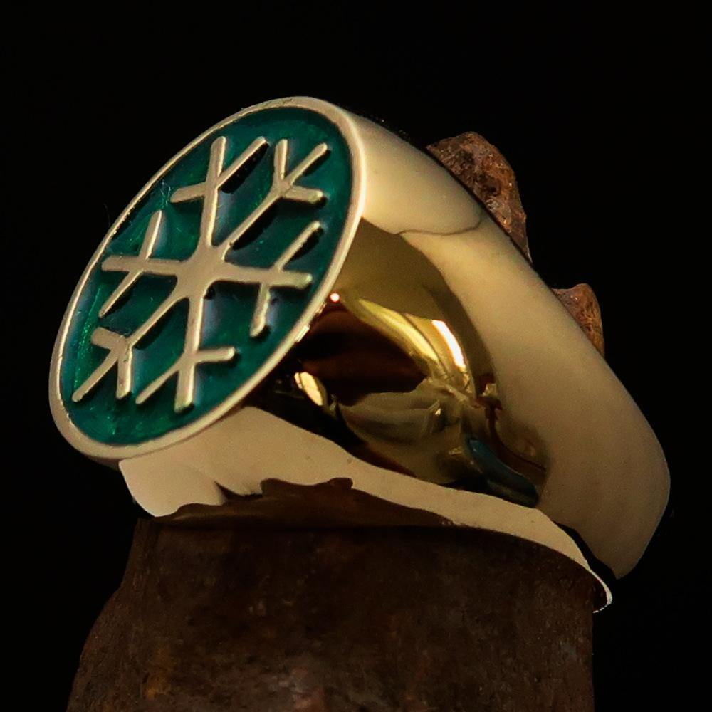 Men's Winter Ring made of solid brass featuring a green snowflake design, polished to a high shine.