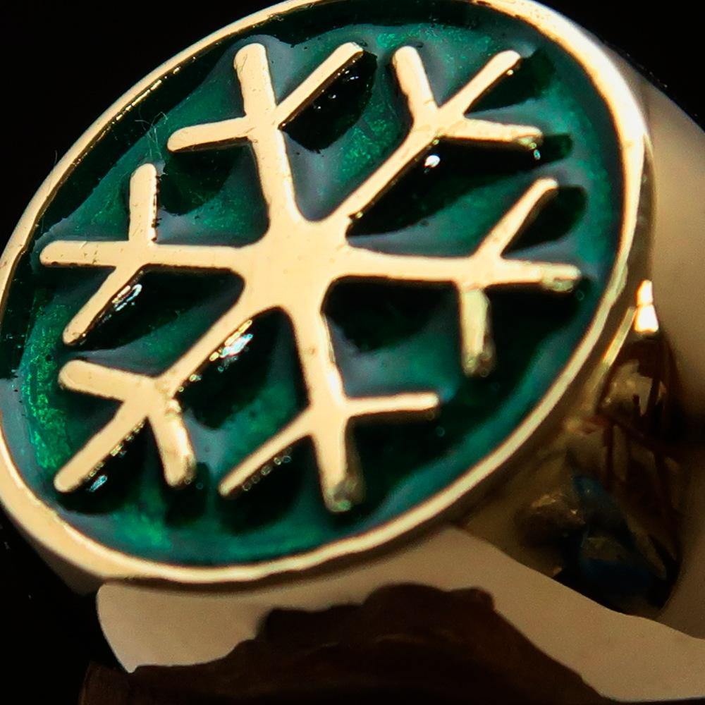 Men's Winter Ring made of solid brass featuring a green snowflake design, polished to a high shine.