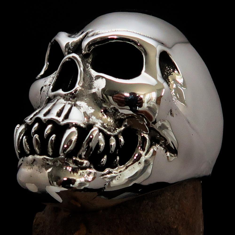 Men's Zombie Fang Skull Ring made of antiqued sterling silver, showcasing a unique skull design with fang details.