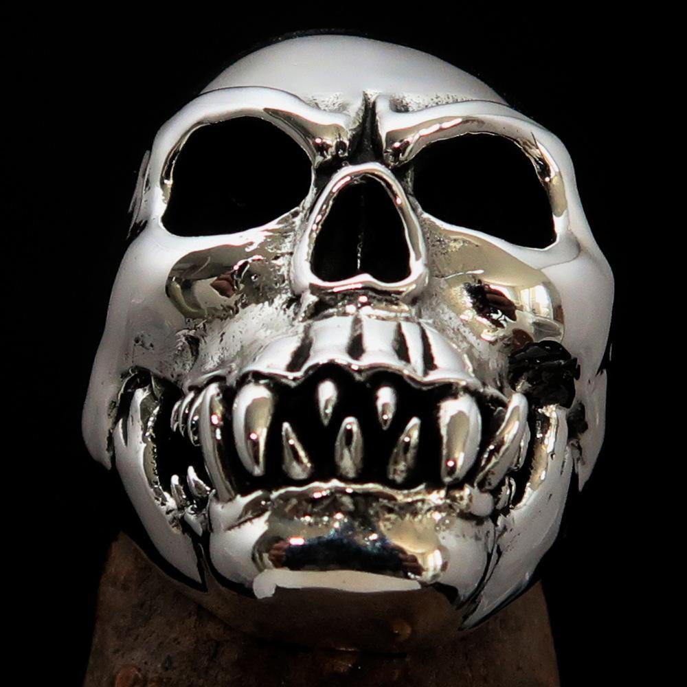 Men's Zombie Fang Skull Ring made of antiqued sterling silver, showcasing a unique skull design with fang details.