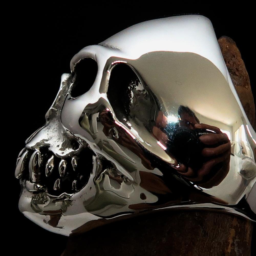 Men's Zombie Fang Skull Ring made of antiqued sterling silver, showcasing a unique skull design with fang details.