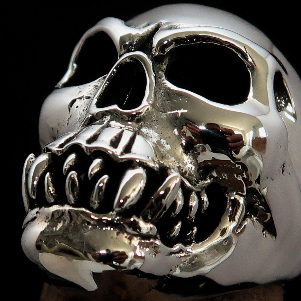 Men's Zombie Fang Skull Ring made of antiqued sterling silver, showcasing a unique skull design with fang details.