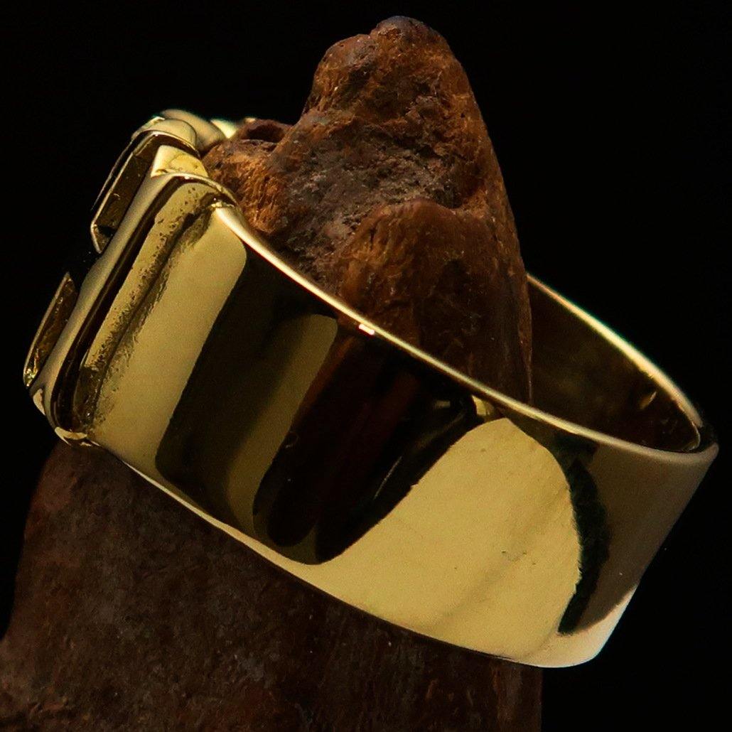 A high polished solid brass ring featuring the word 'Bitch', measuring 12 mm wide, showcasing its elegant design.