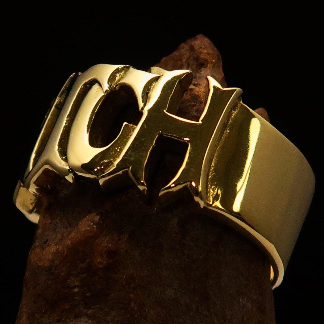 A high polished solid brass ring featuring the word 'Bitch', measuring 12 mm wide, showcasing its elegant design.