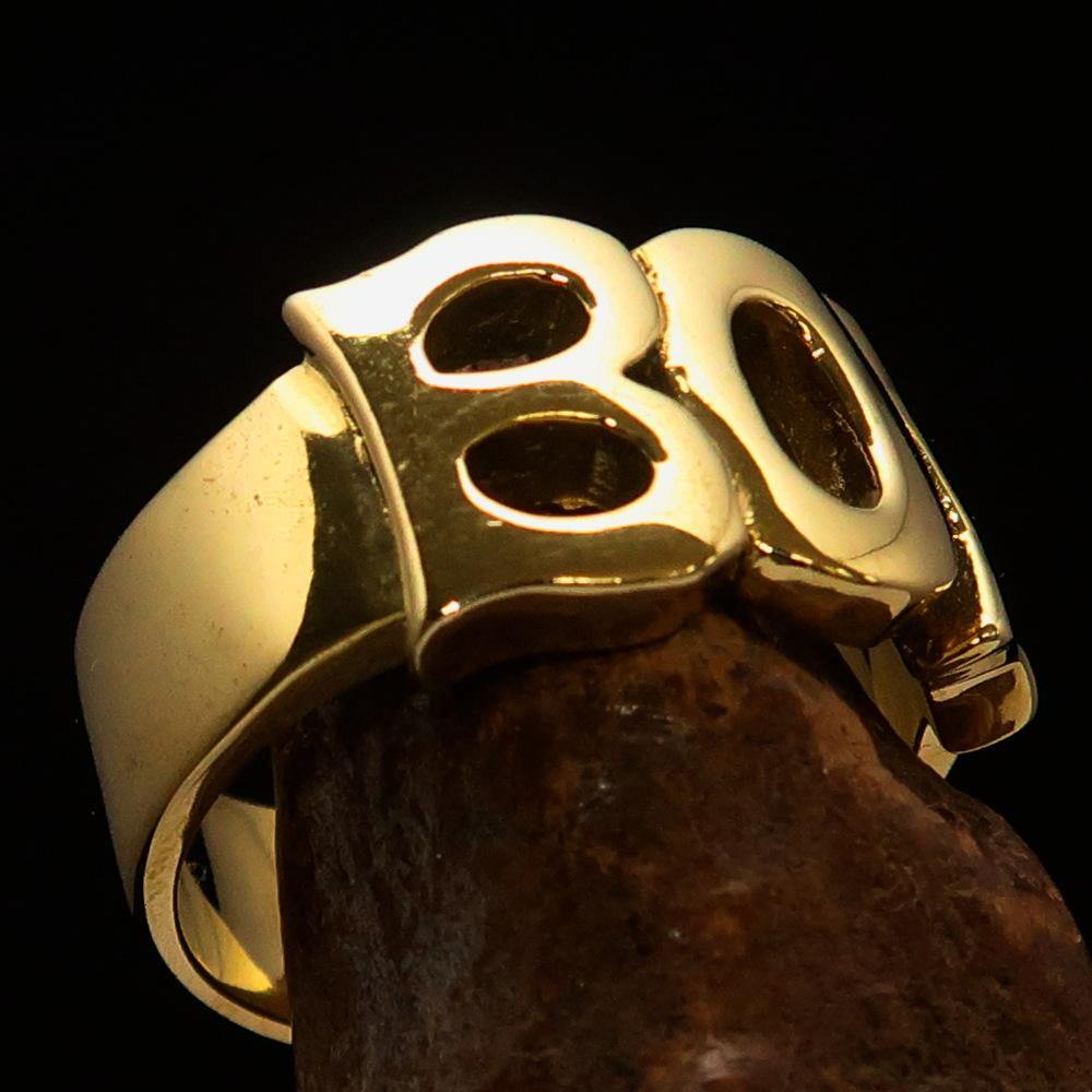 A beautifully crafted One Word Boy Ring made of solid brass, featuring a high polish finish and a width of 12 mm.