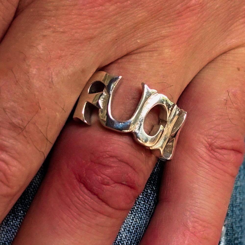 A high polished sterling silver One Word F*ck Ring, showcasing its bold design and hallmarked 925 authenticity.