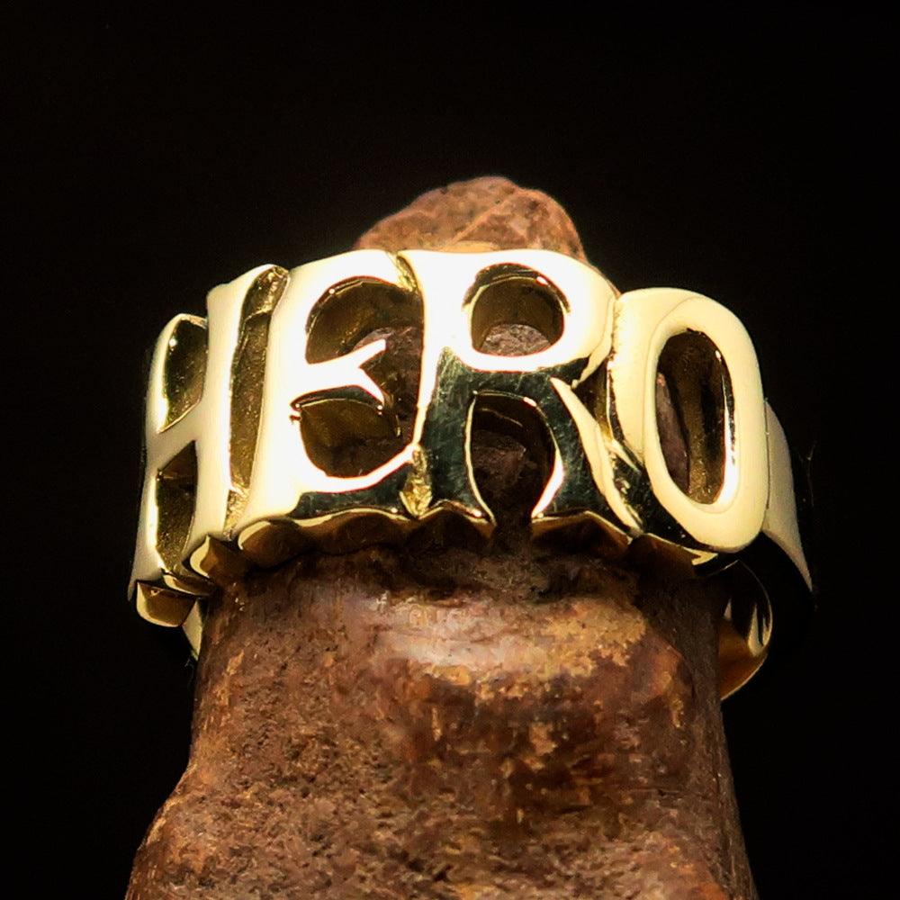 A high-polished solid brass One Word HERO Ring, showcasing its elegant design and 10 mm width.