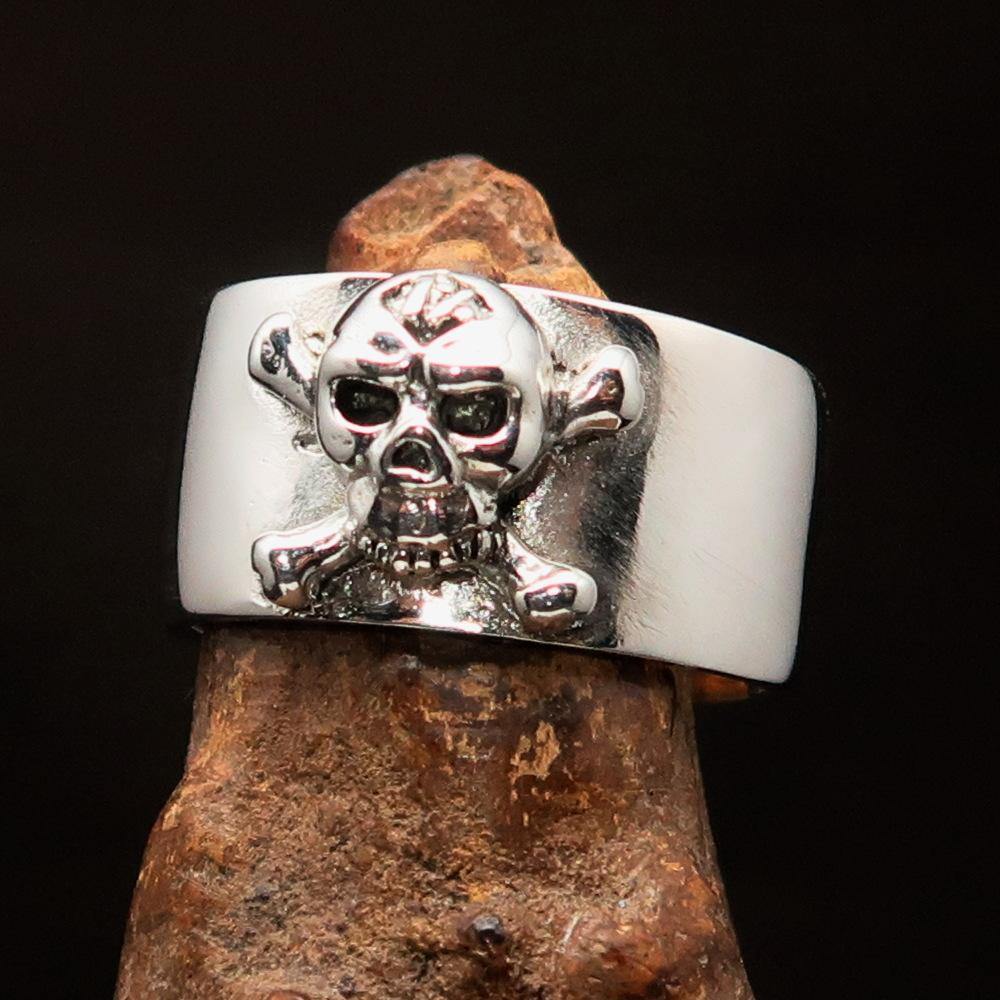 Outlaw 1% Jolly Roger Skull Band Ring made of solid sterling silver with an antiqued finish and polished details.