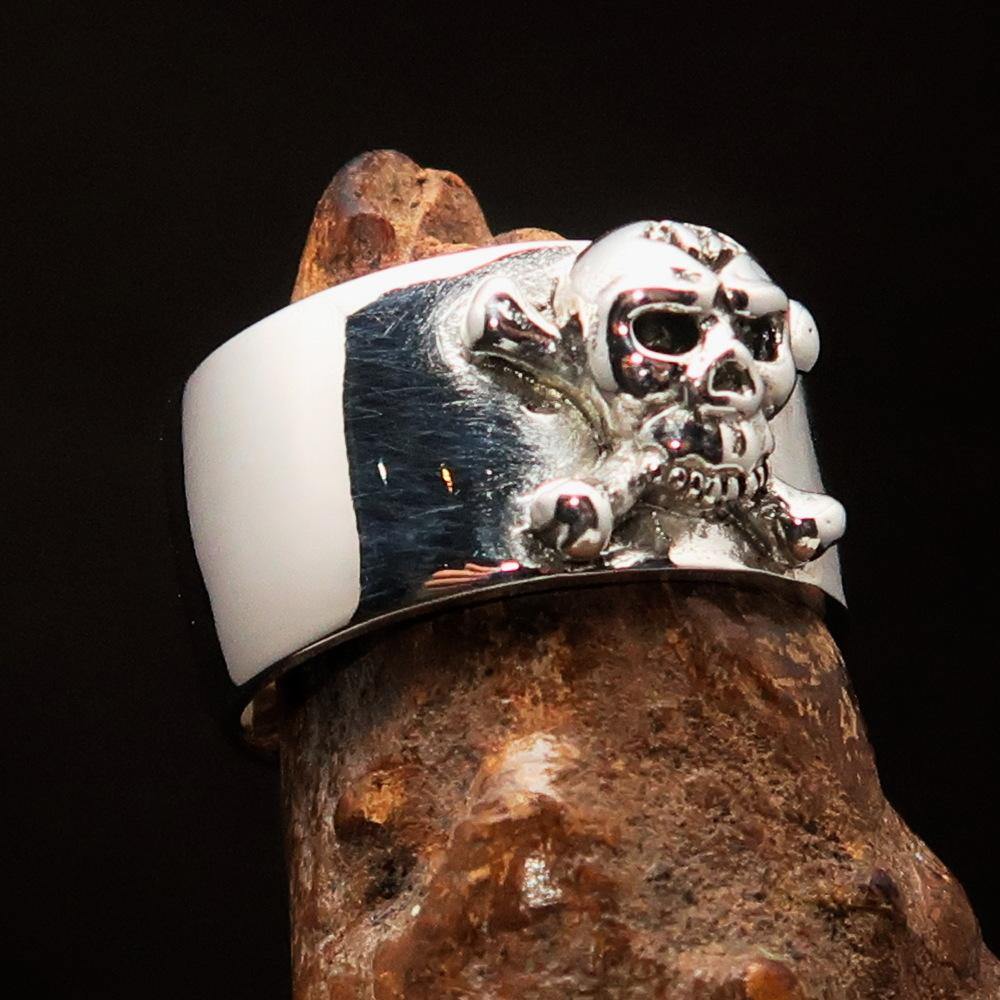 Outlaw 1% Jolly Roger Skull Band Ring made of solid sterling silver with an antiqued finish and polished details.