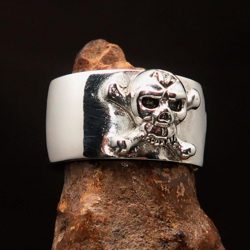 Outlaw 1% Jolly Roger Skull Band Ring made of solid sterling silver with an antiqued finish and polished details.