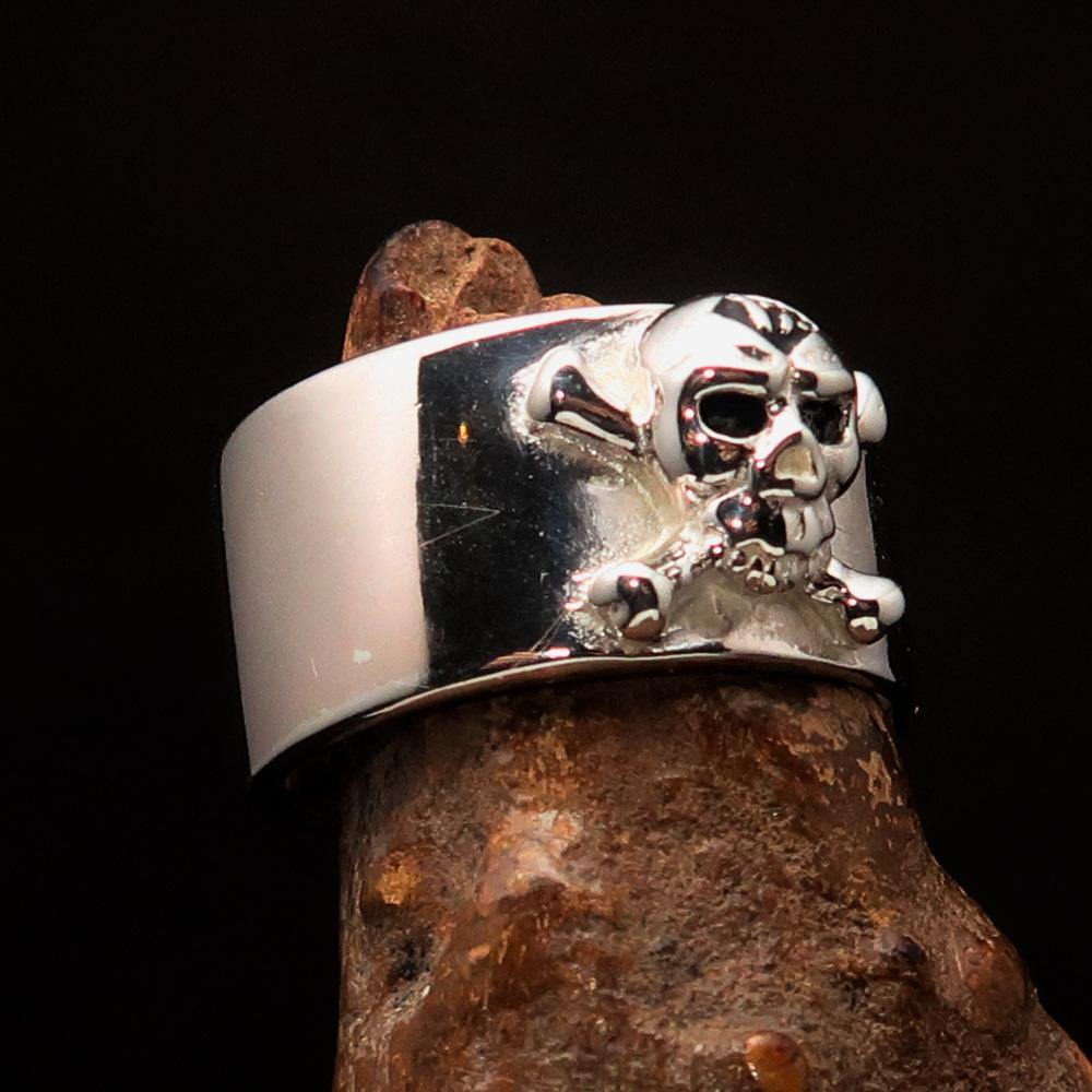 Outlaw black 1% Jolly Roger Skull Band Ring made of solid sterling silver with black enamel finish, showcasing a bold skull design.