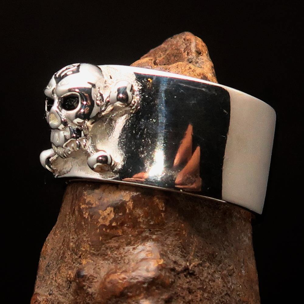 Outlaw black 1% Jolly Roger Skull Band Ring made of solid sterling silver with black enamel finish, showcasing a bold skull design.