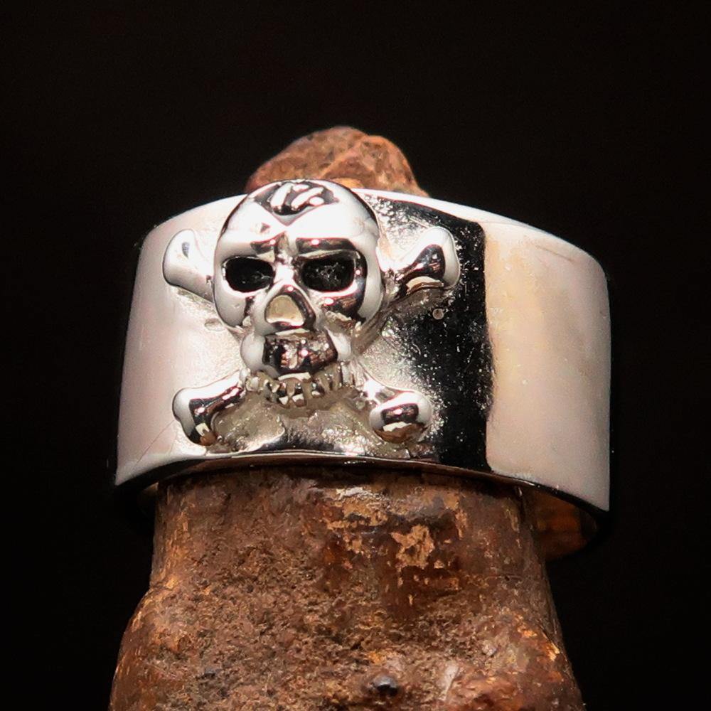 Outlaw black 1% Jolly Roger Skull Band Ring made of solid sterling silver with black enamel finish, showcasing a bold skull design.