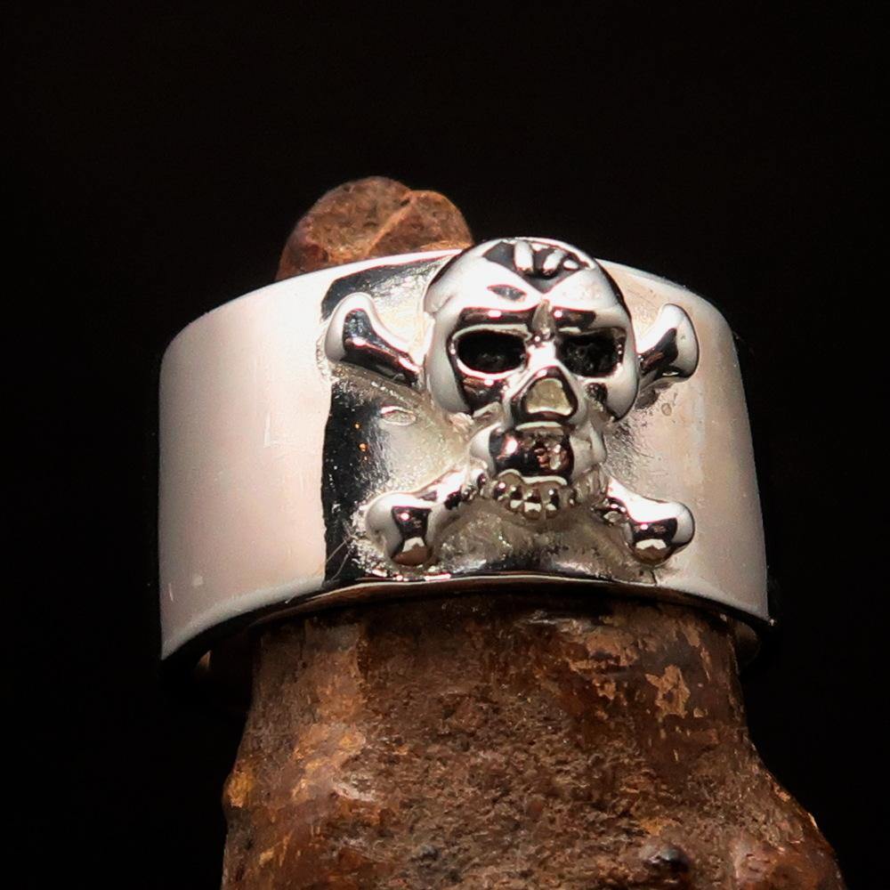 Outlaw black 1% Jolly Roger Skull Band Ring made of solid sterling silver with black enamel finish, showcasing a bold skull design.