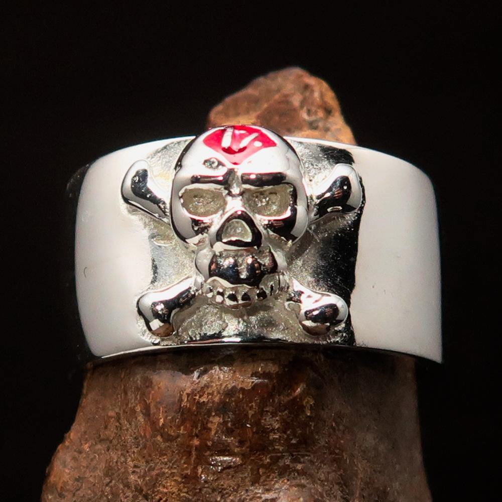 Outlaw red 1% Jolly Roger Skull Band Ring made of sterling silver with red enamel detailing, showcasing a polished finish.