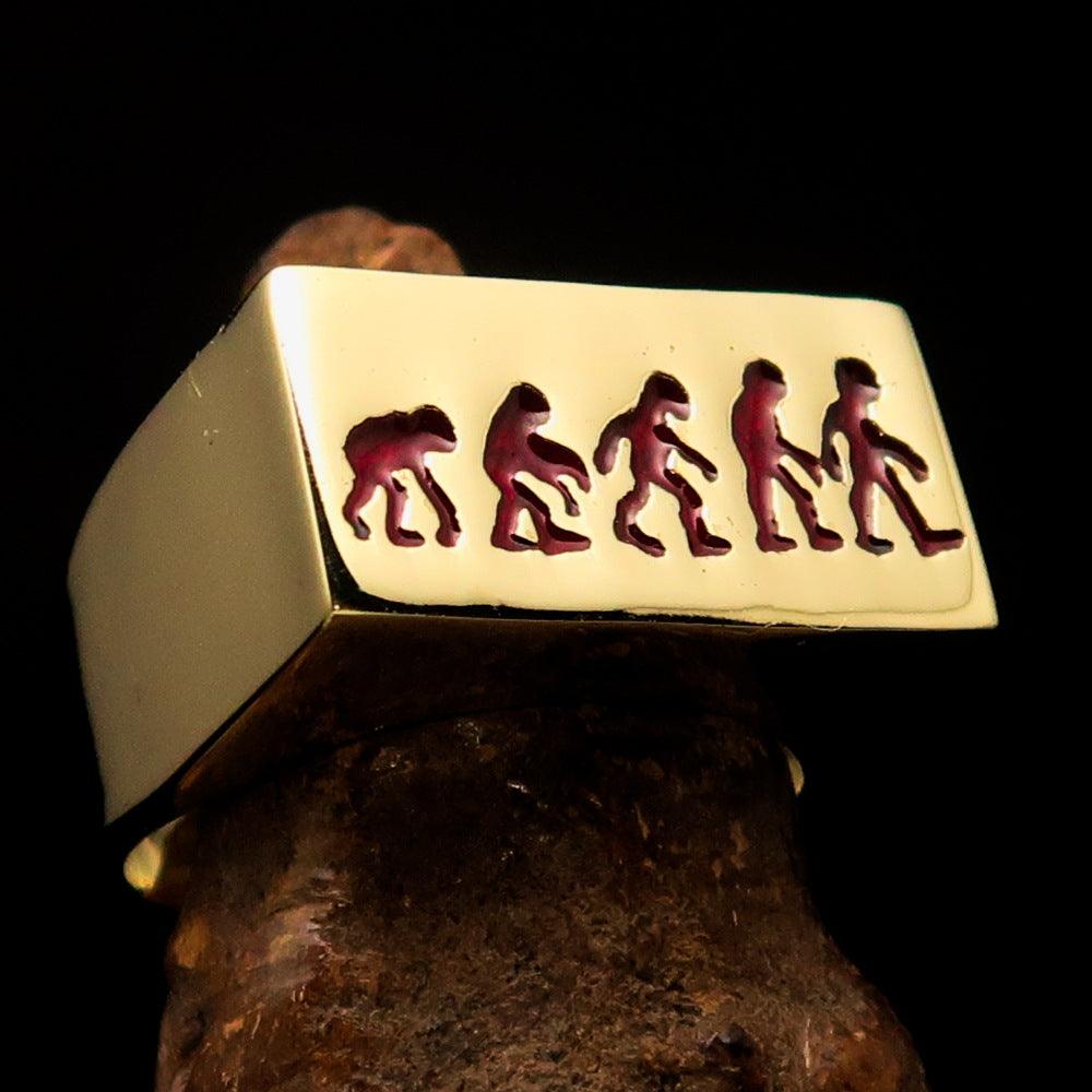 Rectangle-shaped red Human Evolution Ring made of solid brass with high-polished finish and red enamel.