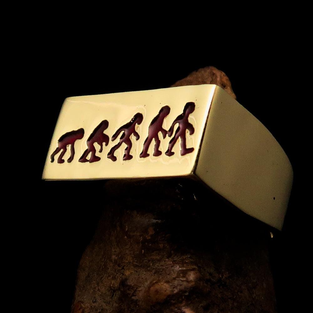 Rectangle-shaped red Human Evolution Ring made of solid brass with high-polished finish and red enamel.