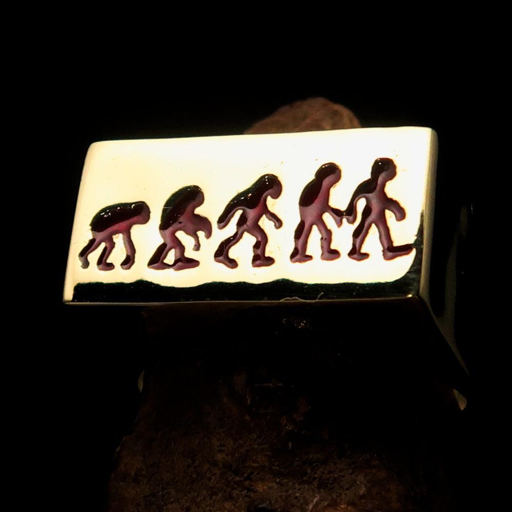 Rectangle-shaped red Human Evolution Ring made of solid brass with high-polished finish and red enamel.