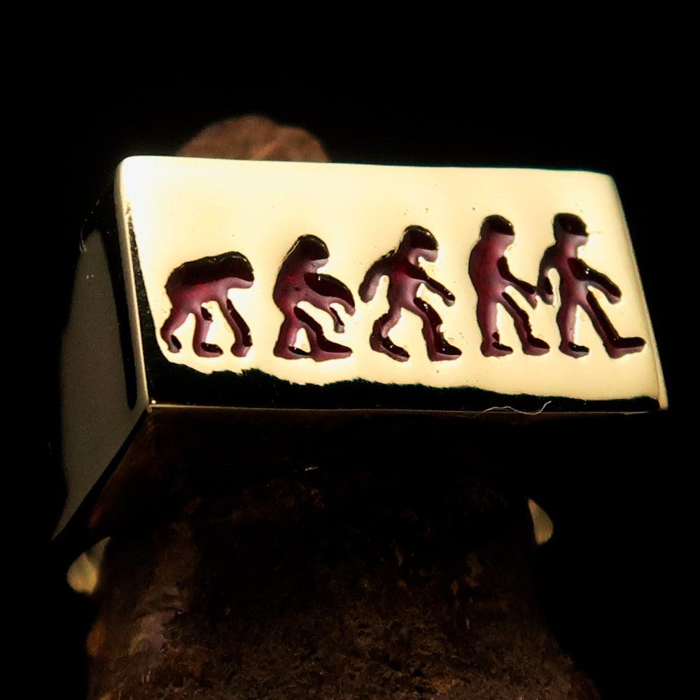 Rectangle-shaped red Human Evolution Ring made of solid brass with high-polished finish and red enamel.