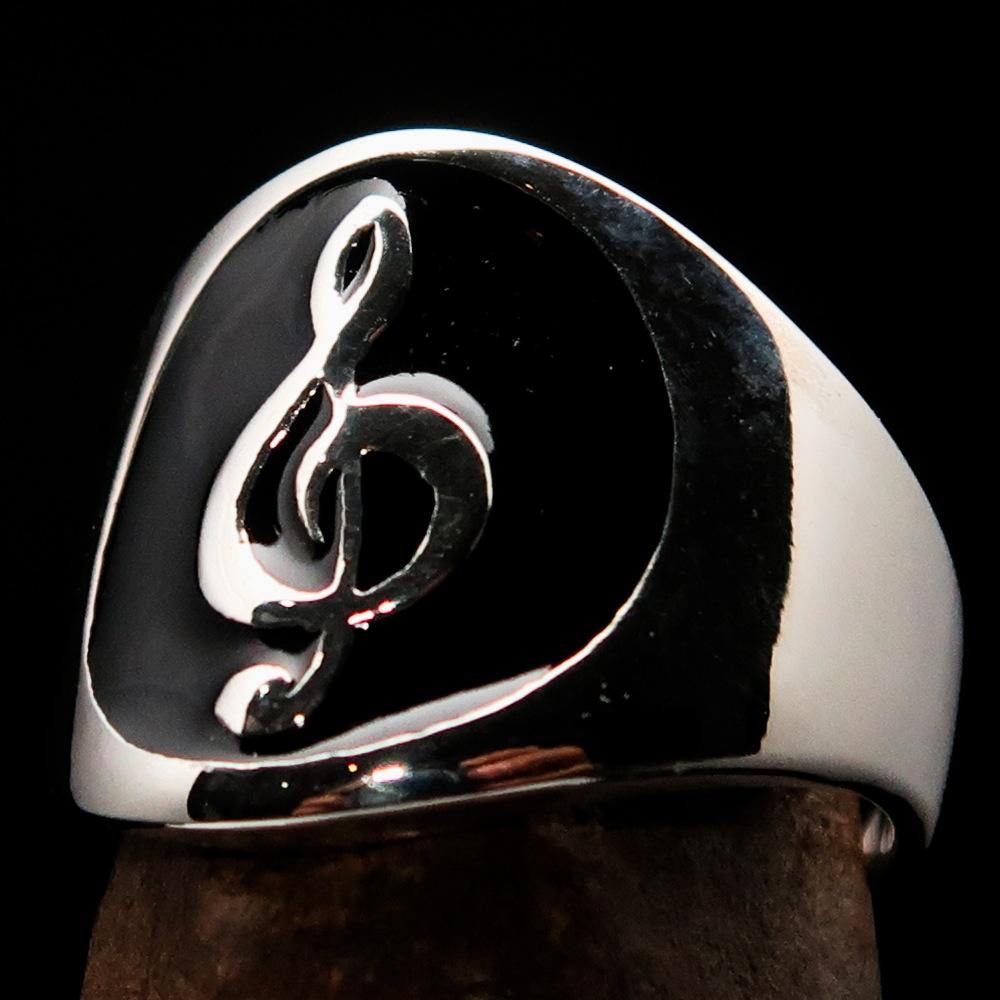 Men's black Treble Clef Ring made of high-polished sterling silver with black enamel, showcasing a musical symbol.