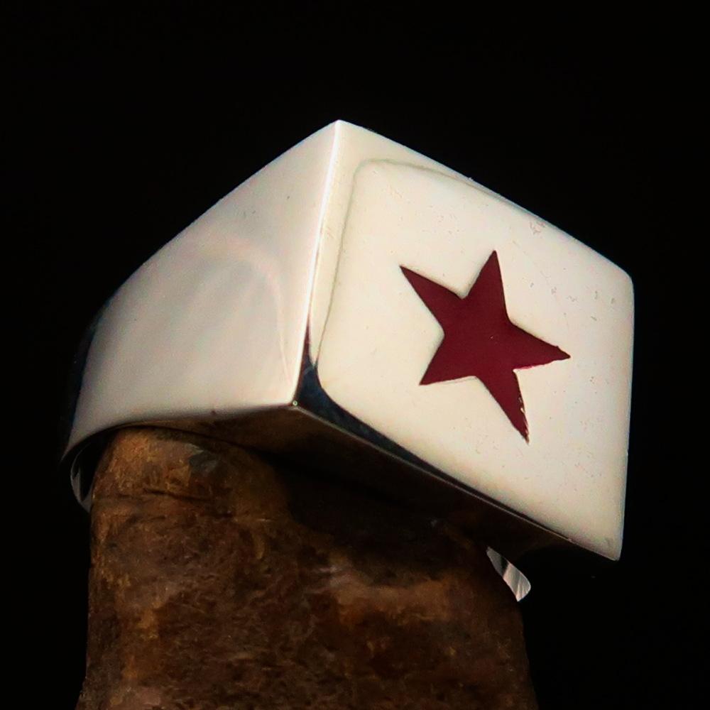 A beautifully crafted sterling silver men's ring featuring a red enamel star, hallmarked 925 with the RCRN logo engraved.