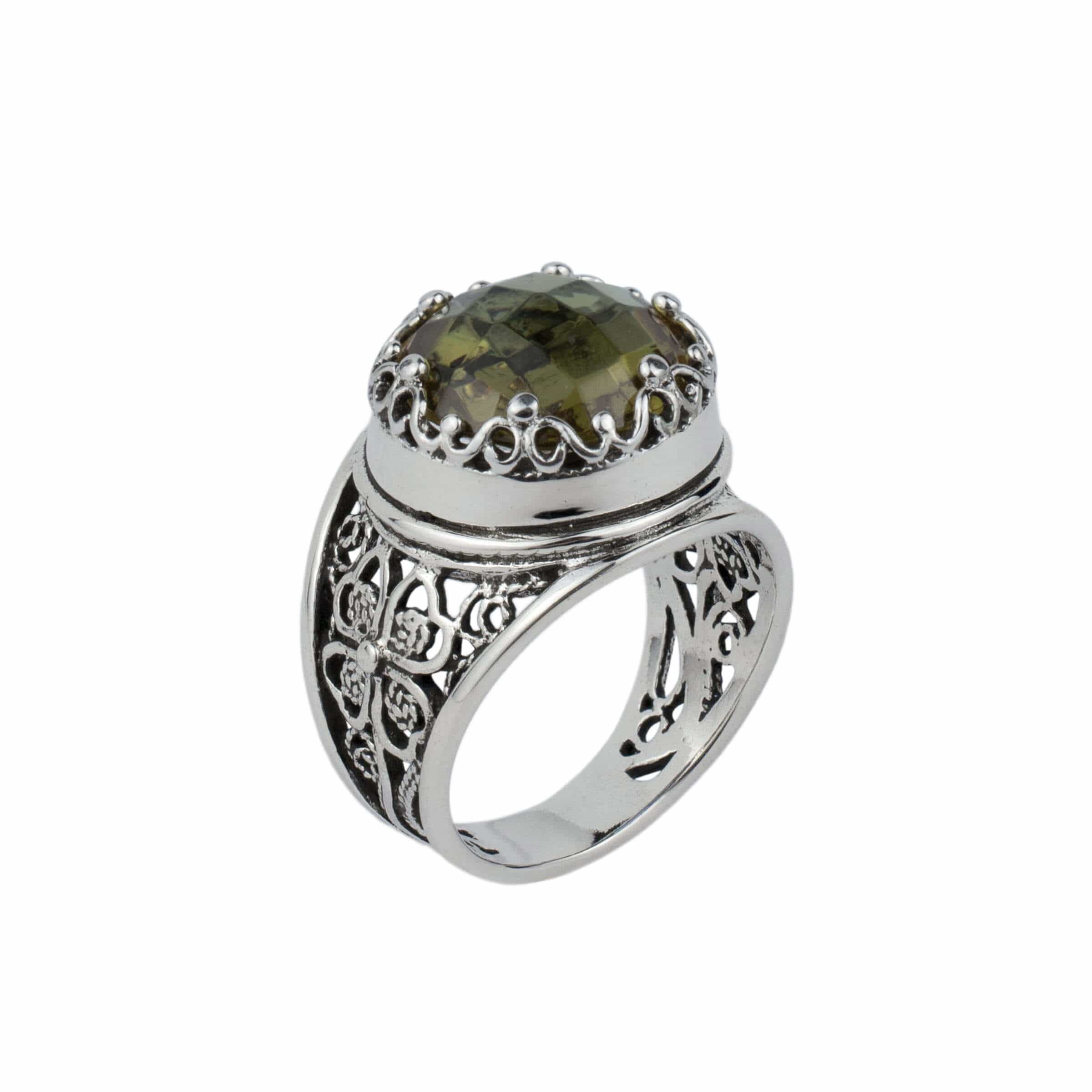 A stunning sterling silver statement ring featuring a lab-created Alexandrite gemstone in a delicate filigree design.