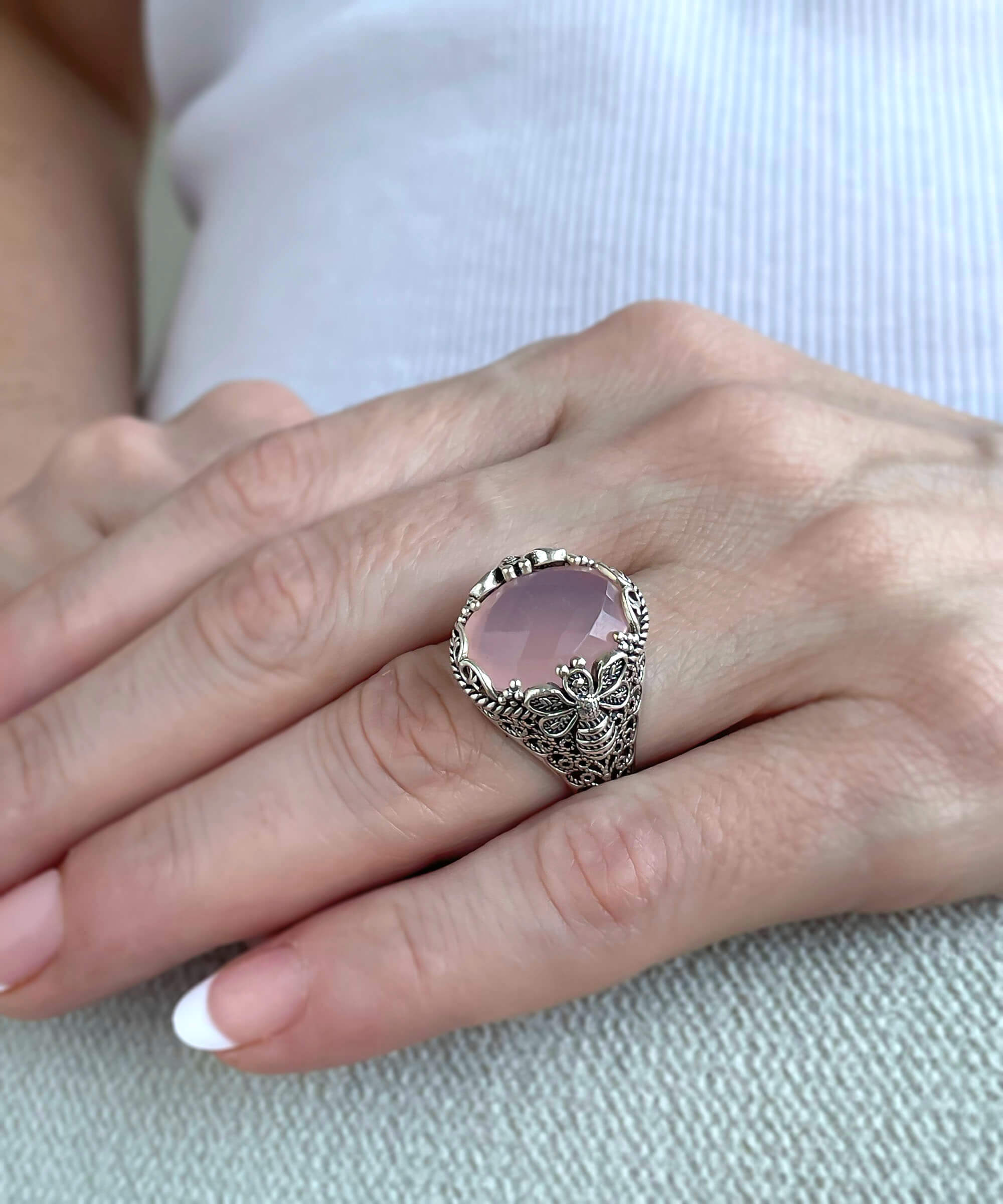 Elegant 925 sterling silver ring featuring a pink chalcedony gemstone with intricate filigree art bee detailing.