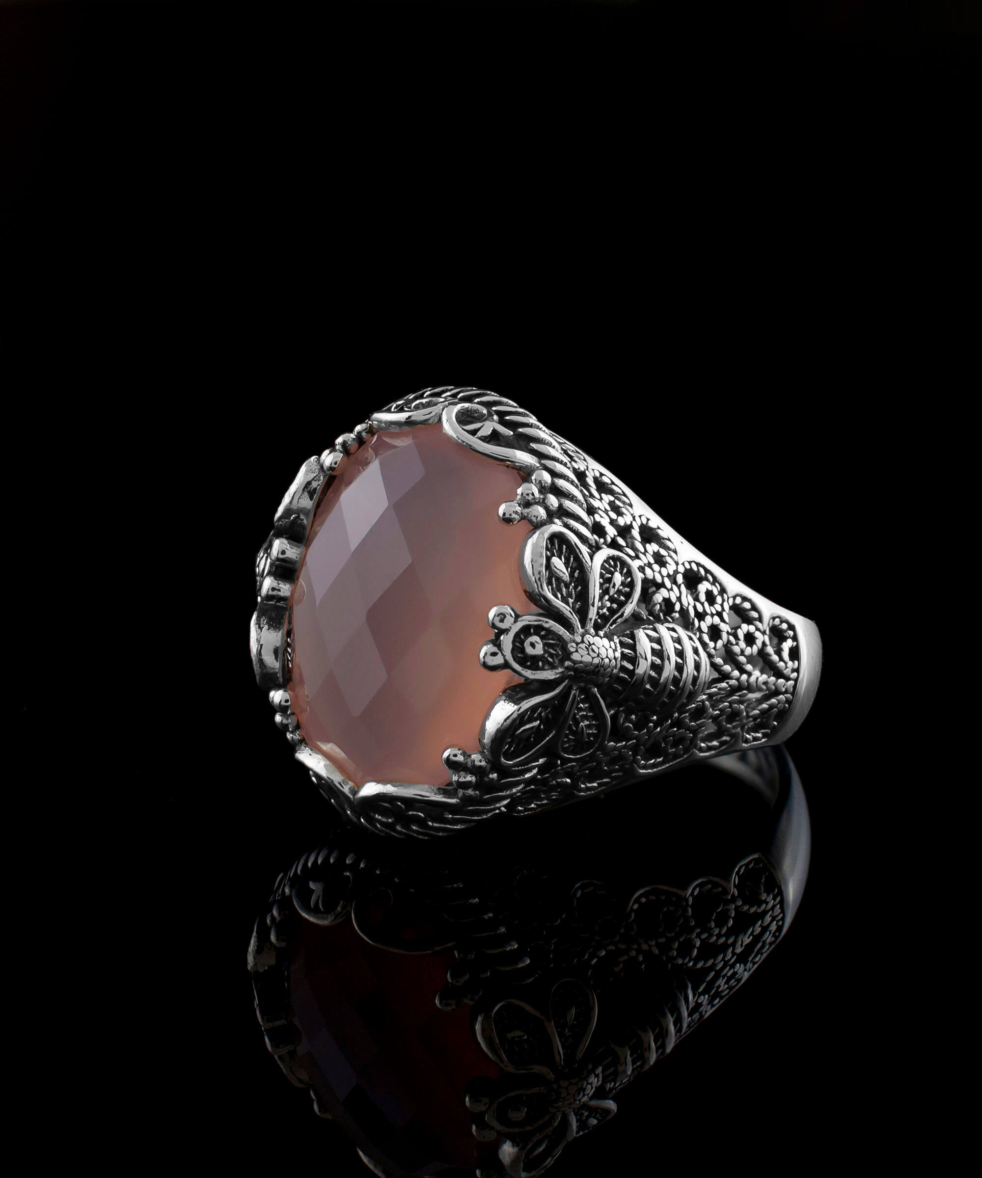 Elegant 925 sterling silver ring featuring a pink chalcedony gemstone with intricate filigree art bee detailing.