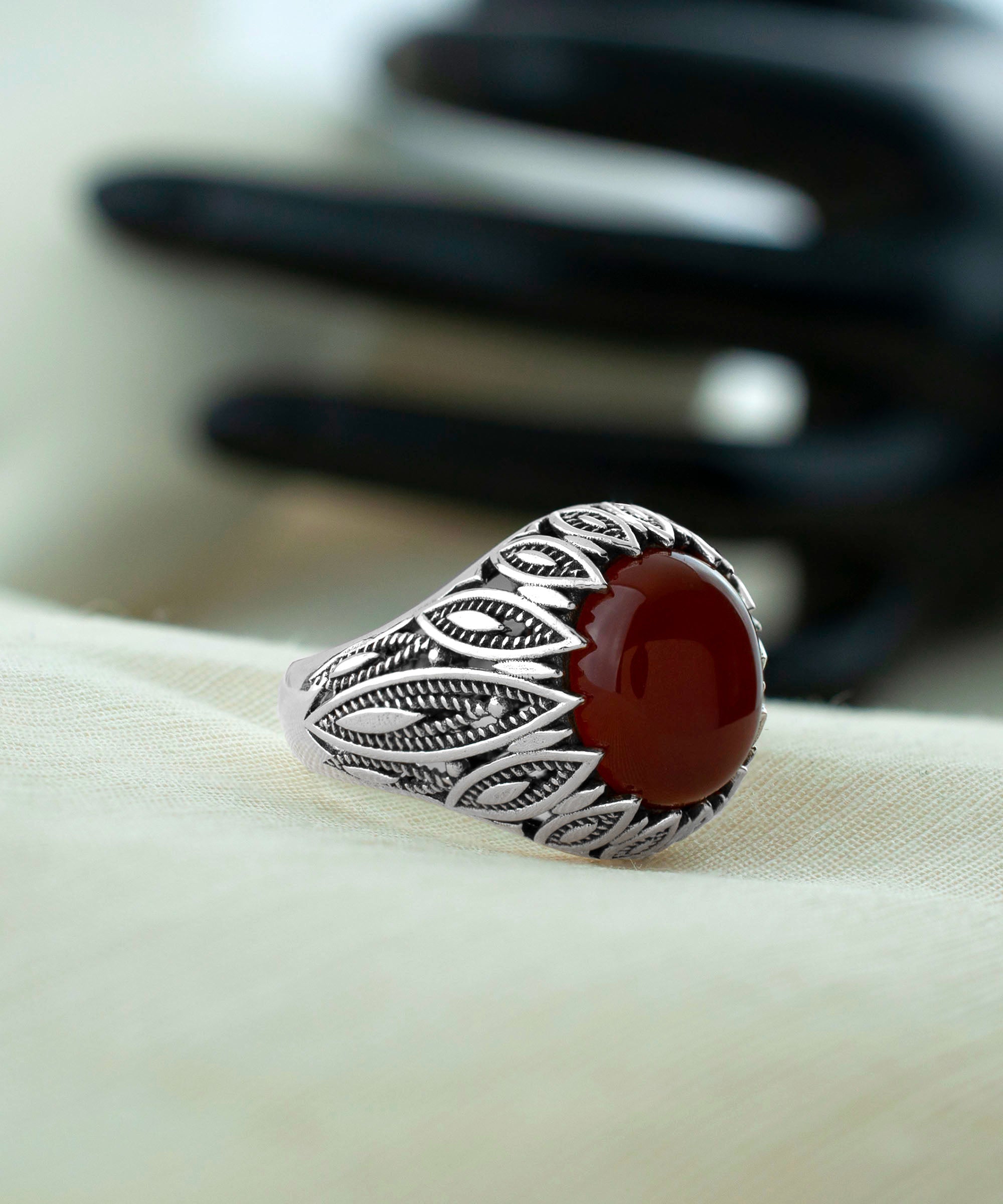 Elegant Filigree Art Carnelian Gemstone Women Silver Statement Ring showcasing intricate metalwork and a vibrant oval-cut Carnelian gemstone.