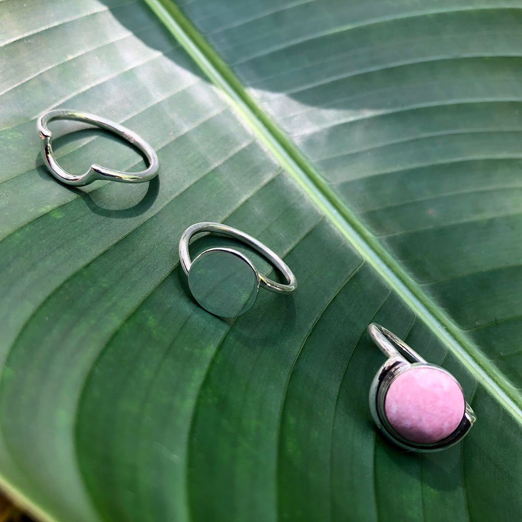 A minimalist Full Moon Ring made of sterling silver, showcasing a smooth, round design that reflects the beauty of the moon.