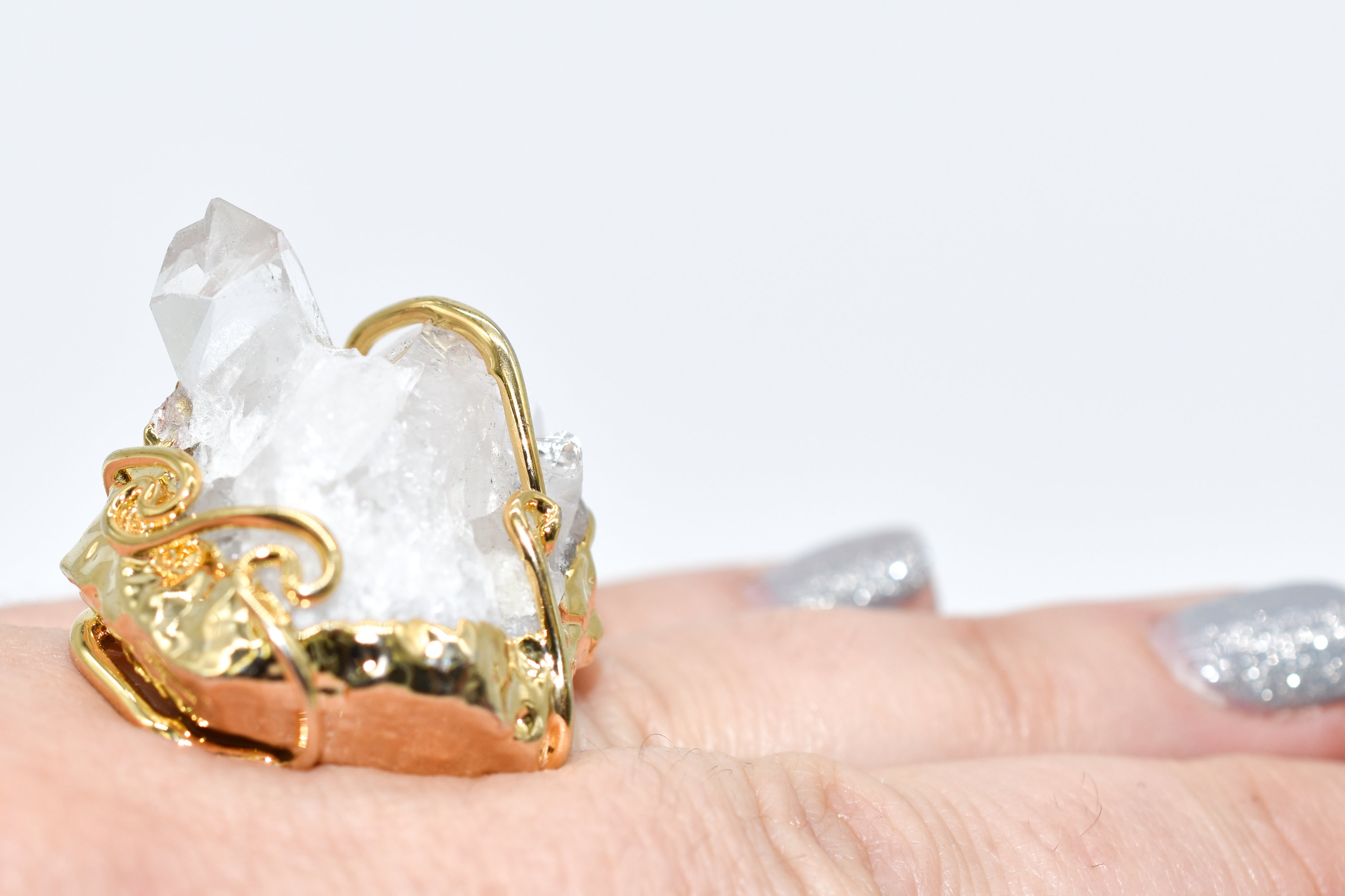 A stunning gold dipped crystal druzy ring featuring a sparkling natural druzy stone, elegantly wire wrapped and adjustable for a perfect fit.