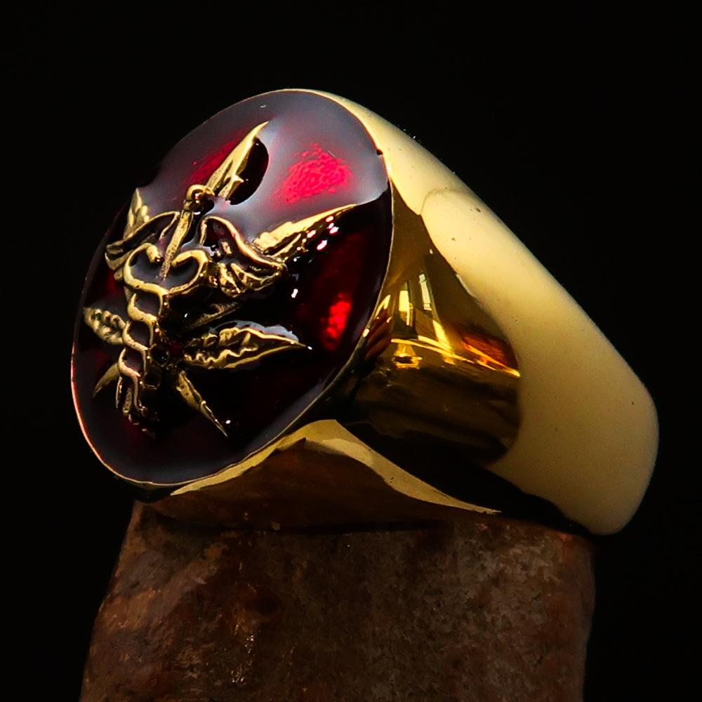 Men's solid brass ring featuring a cannabis leaf design with red enamel finish, symbolizing marijuana culture.