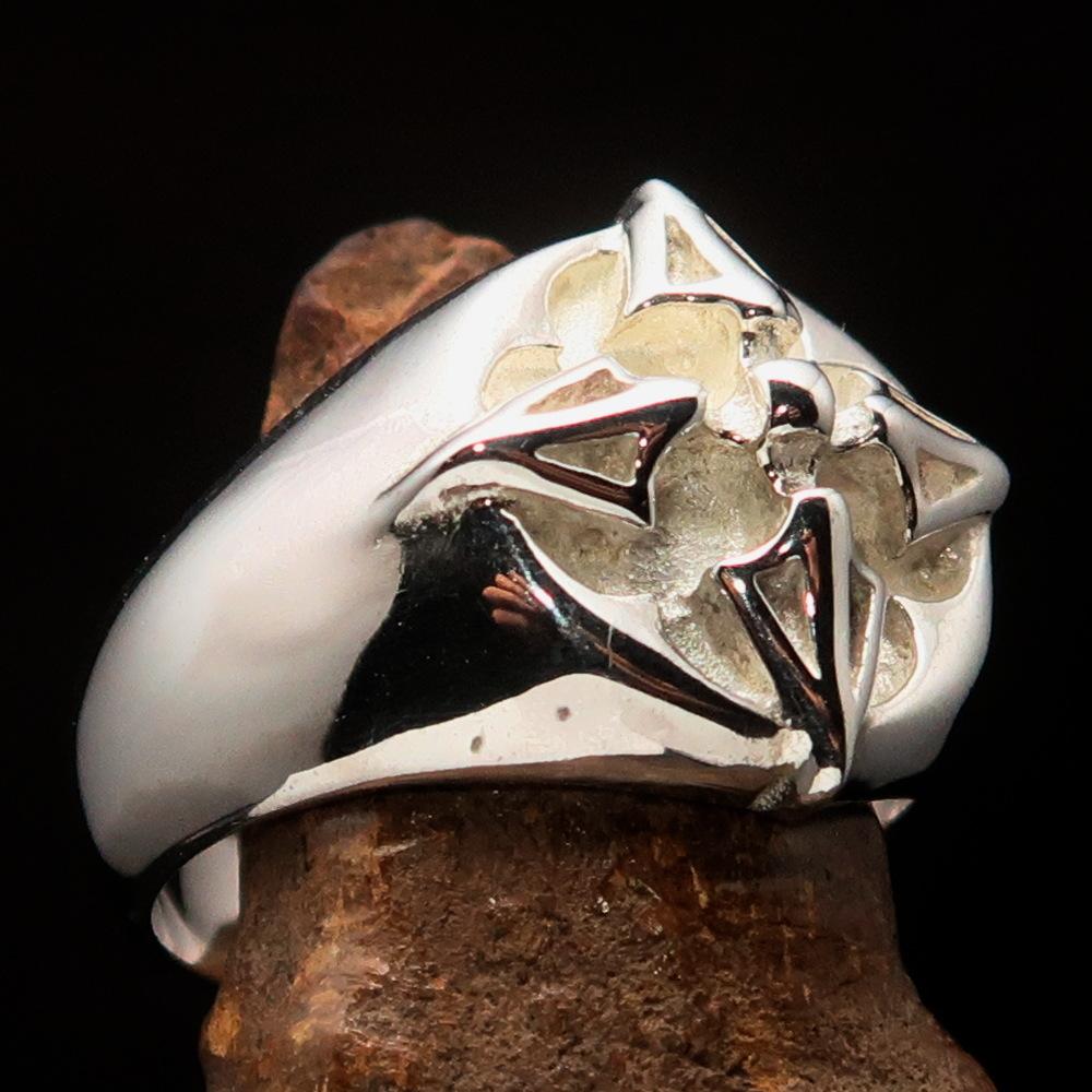 Men's sterling silver ring featuring crossed Tibetan Thunderbolts design, polished finish, and hallmarked 925 for authenticity.