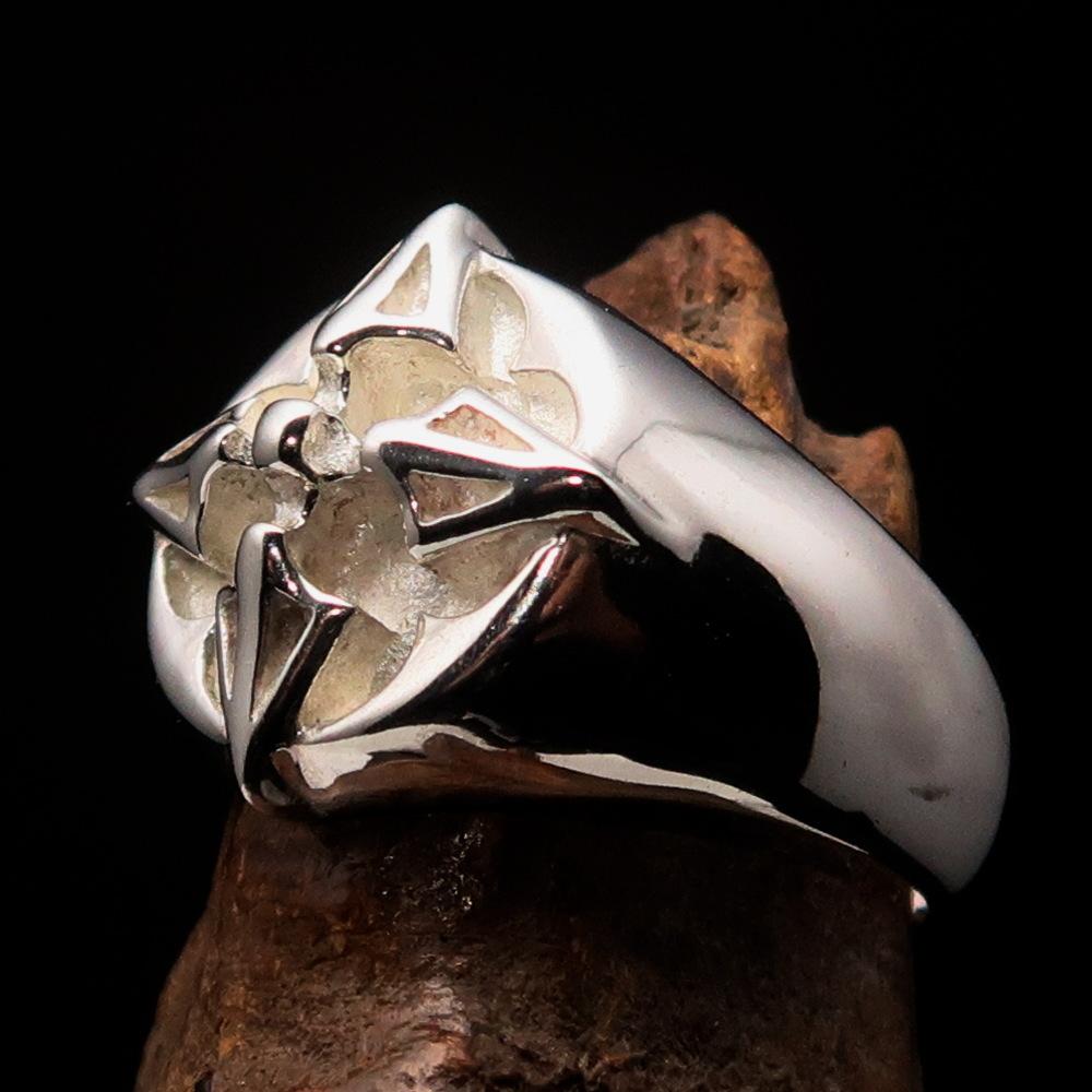 Men's sterling silver ring featuring crossed Tibetan Thunderbolts design, polished finish, and hallmarked 925 for authenticity.