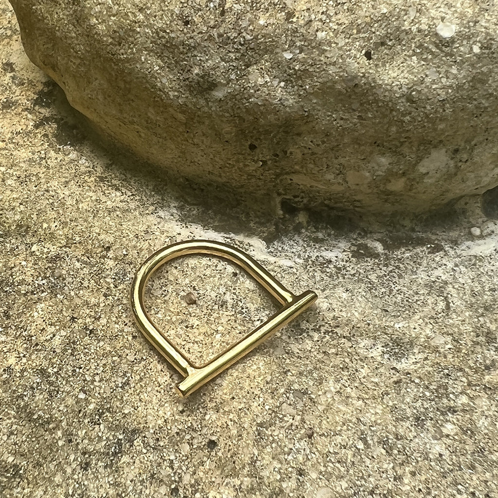 Minimal Bar Bombshell Ring handcrafted from recycled materials with gold plating, showcasing its elegant design.