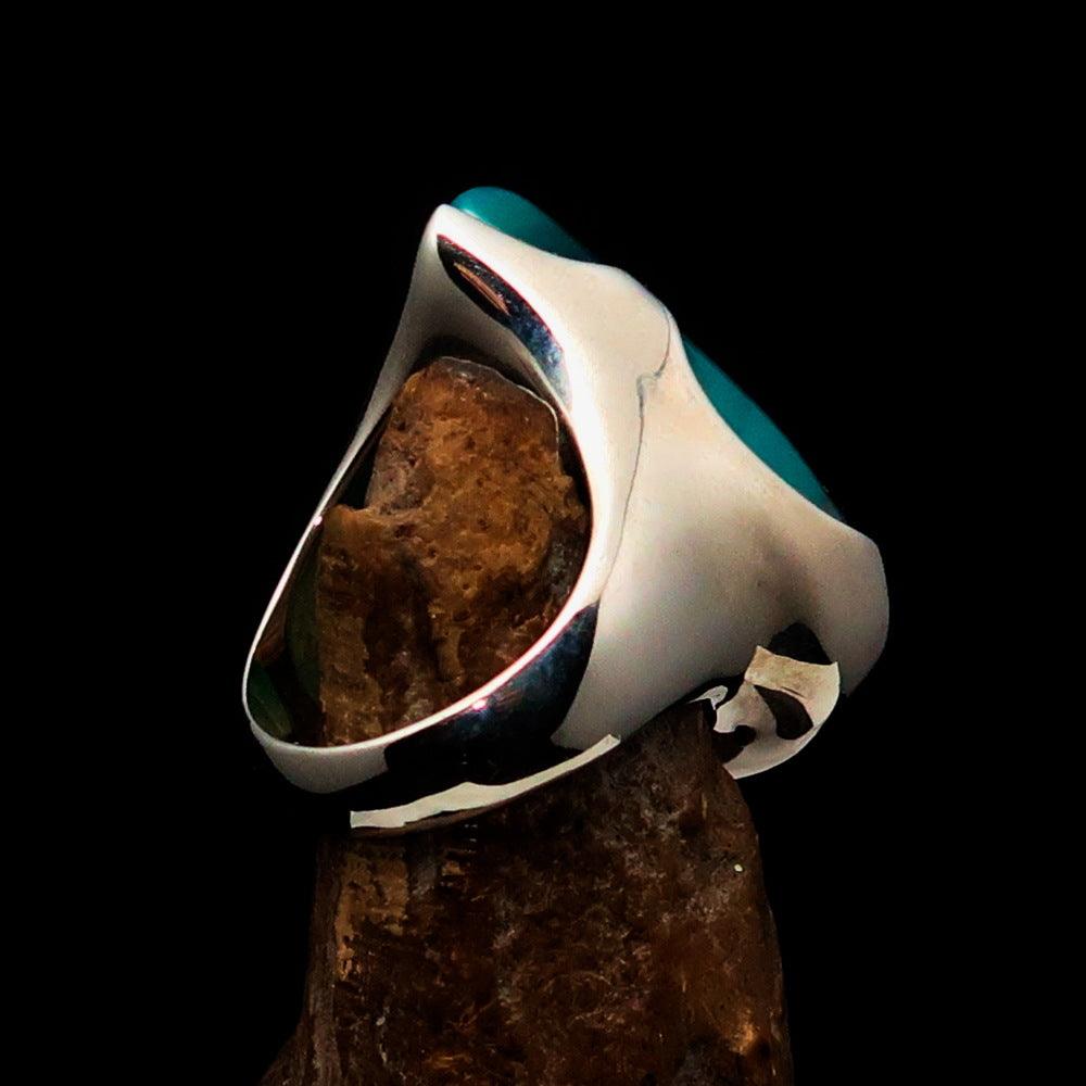 Minimalistic sterling silver ring featuring a pear-shaped green Agate cabochon, polished to a mirror finish.