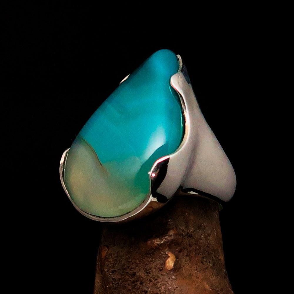 Minimalistic sterling silver ring featuring a pear-shaped green Agate cabochon, polished to a mirror finish.