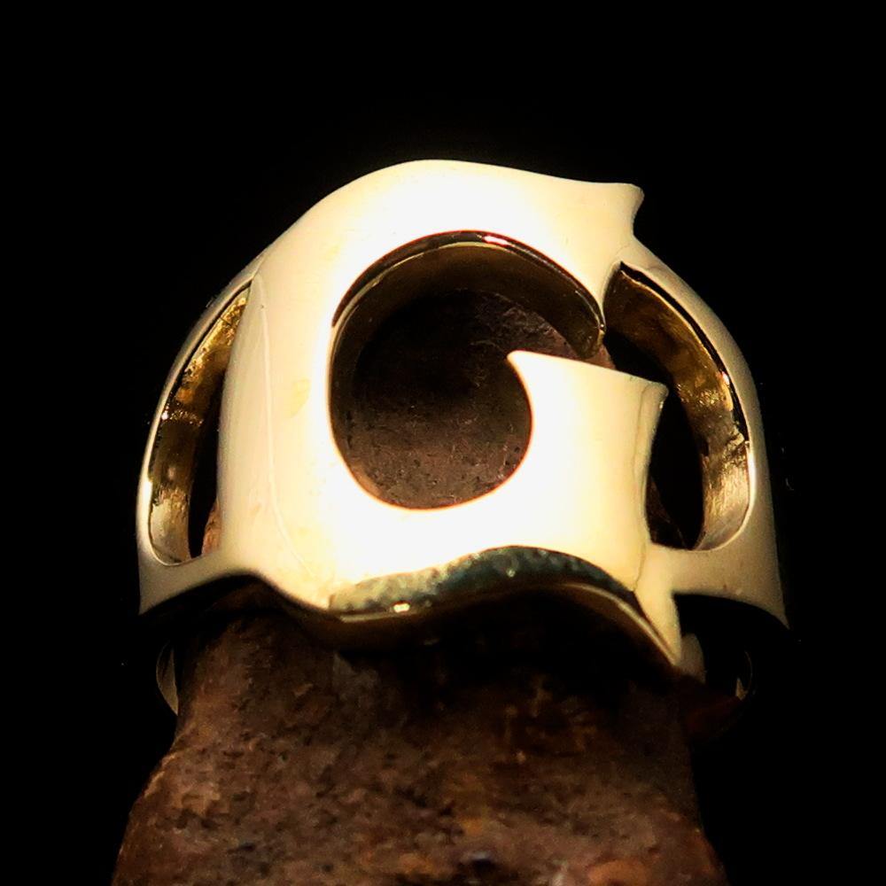 Mirror polished men's brass initial ring featuring a bold letter G, showcasing a sleek and sophisticated design.