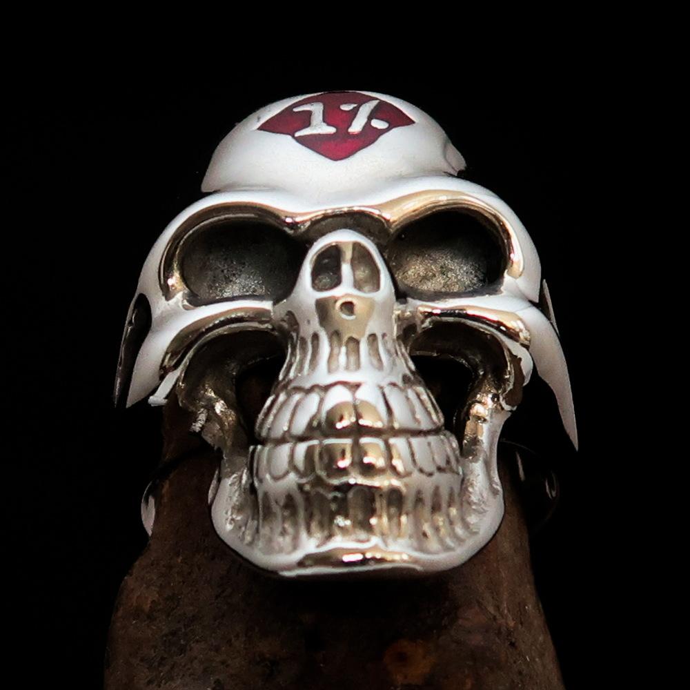 Mirror polished Men's Sterling Silver Outlaw Biker Ring featuring a skull design with red enamel accents, showcasing its high-quality craftsmanship.